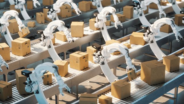 Robots with boxes in a manufacturing plant