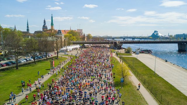 Large group of people running an organized race