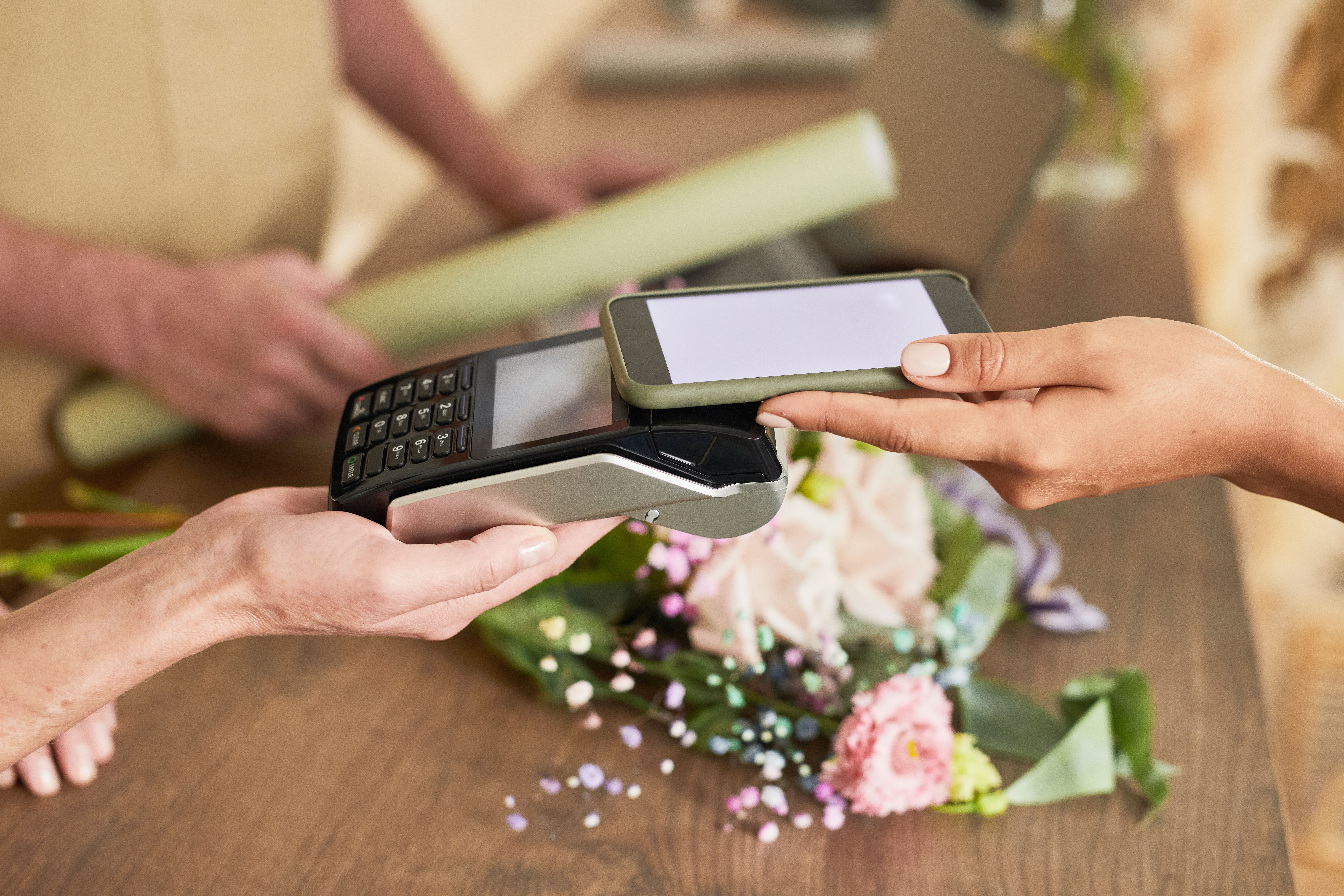 Incomm Payments transaction Customer paying for flowers via their phone and Incomm Payments