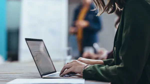 Person working at a laptop. Person working at a laptop.