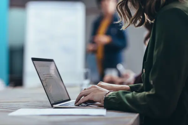 Person working at a laptop.  Person working at a laptop.