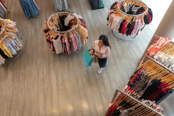 Woman in a retail clothing store Woman in a retail clothing store