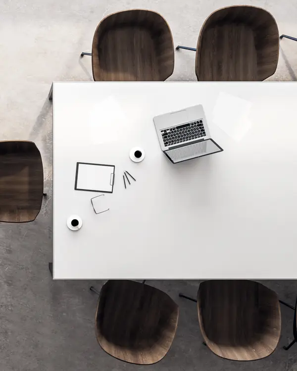 White table with chairs and a laptop White table with chairs and a laptop