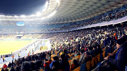 People sitting in a sports stadium 