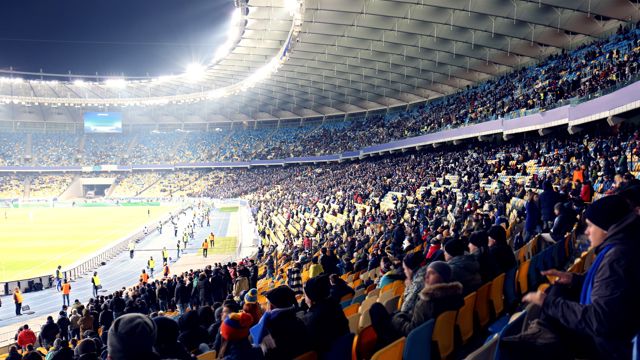 People sitting in a sports stadium 