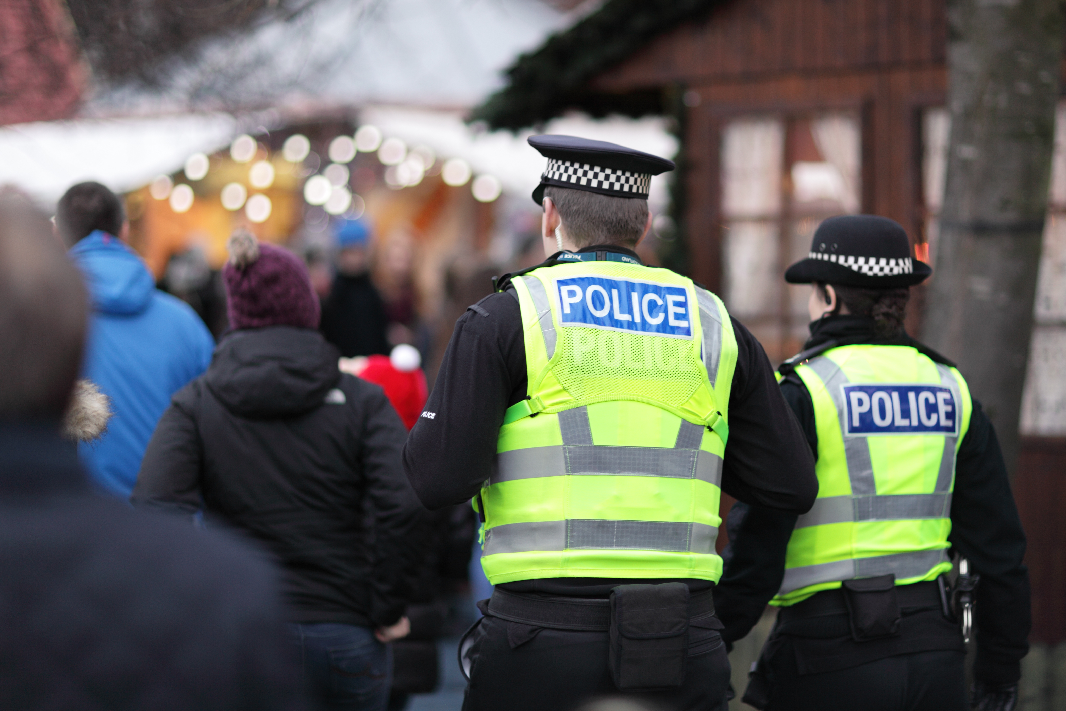Image of 2 British police officers in high visibility yellow jacket