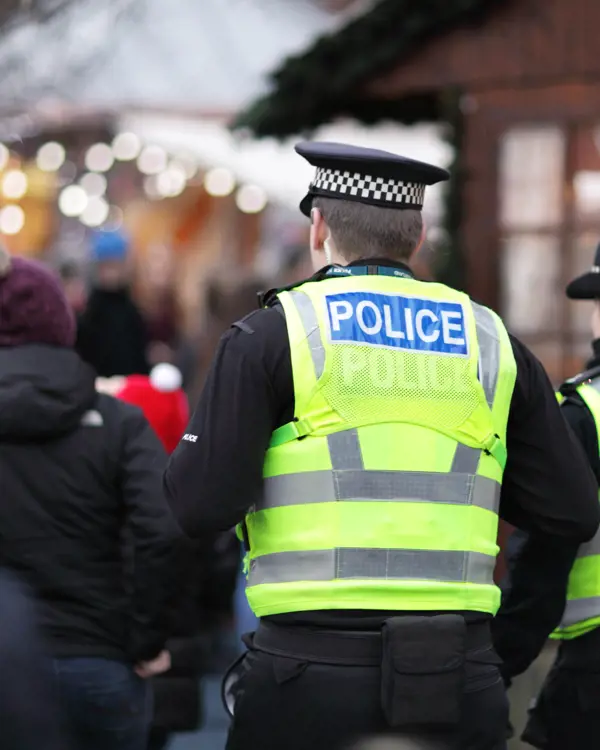 Image of 2 British police officers in high visibility yellow jacket Image of 2 British police officers in high visibility yellow jacket