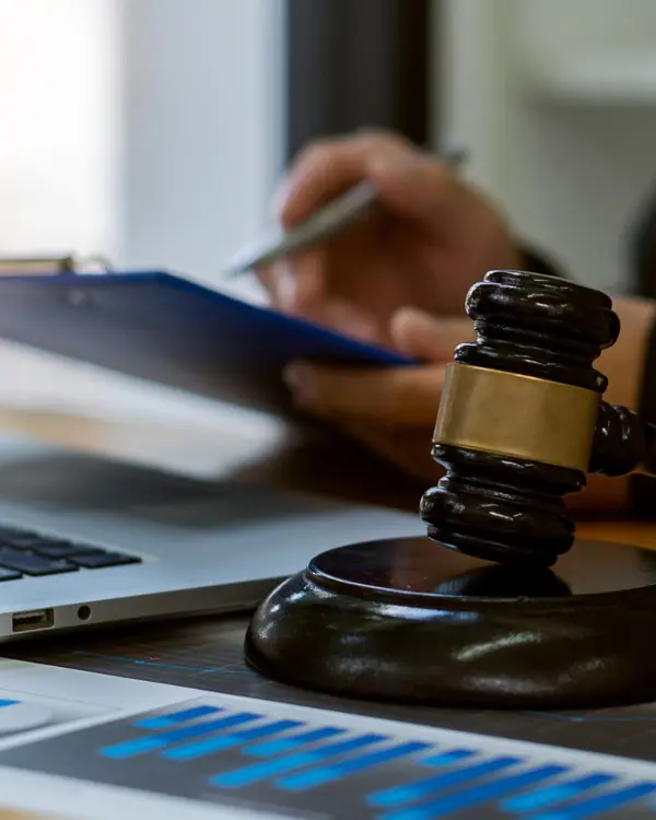 Judge gavel beside a laptop Judge gavel beside a laptop