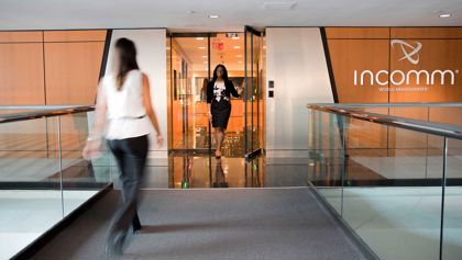 Incomm Payments Office Women walking in Incomm Payments offices.