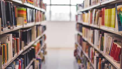 Two rows of bookshelves in a library