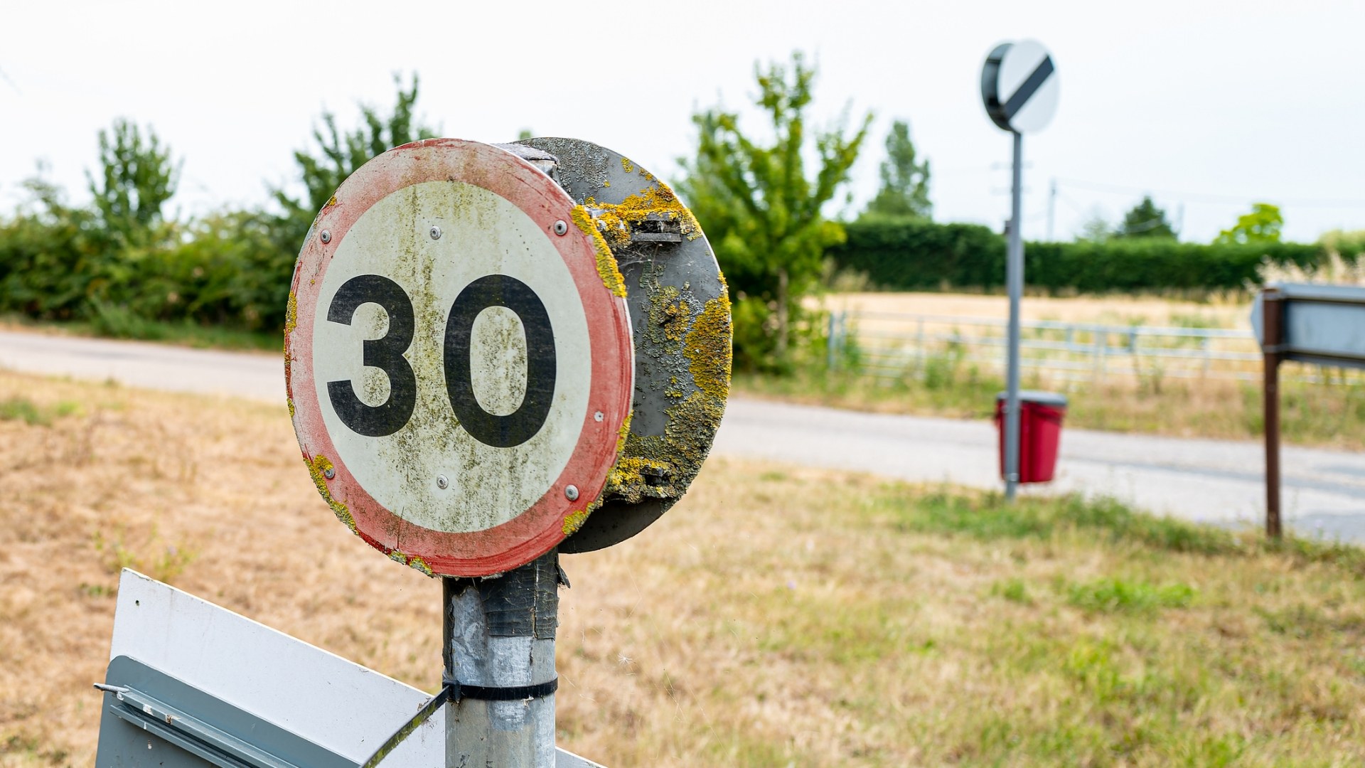 A rusty speed limit sign 